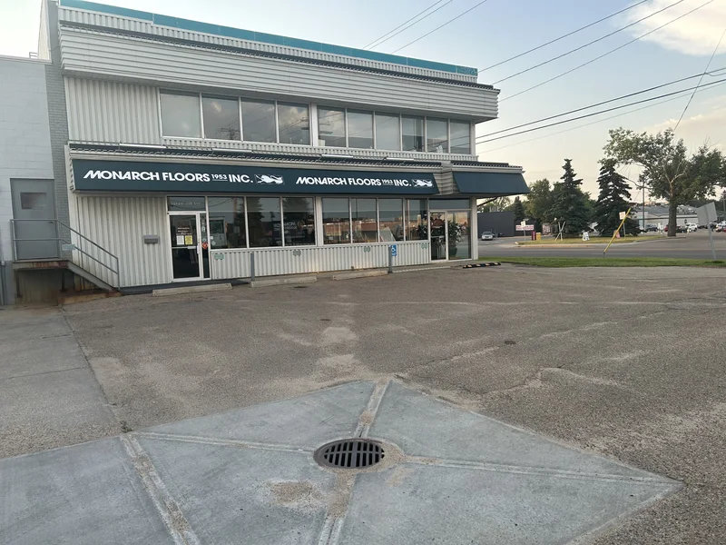 Modern seating area with hardwood flooring installed in a herringbone pattern