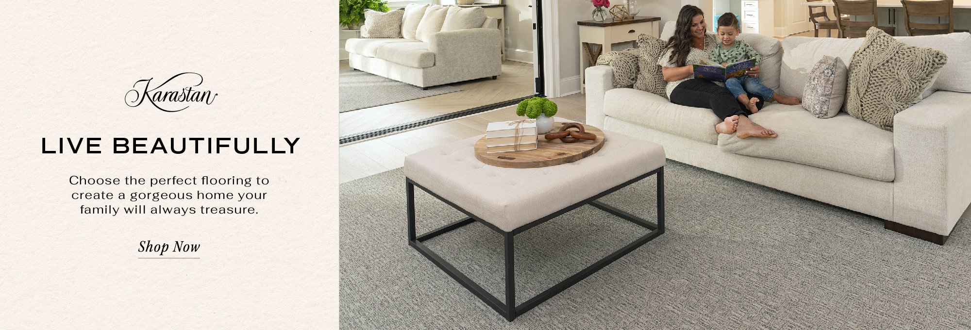 Karastan Carpet Promotion featuring a living room with grey carpet flooring and a mother and child reading on the sofa